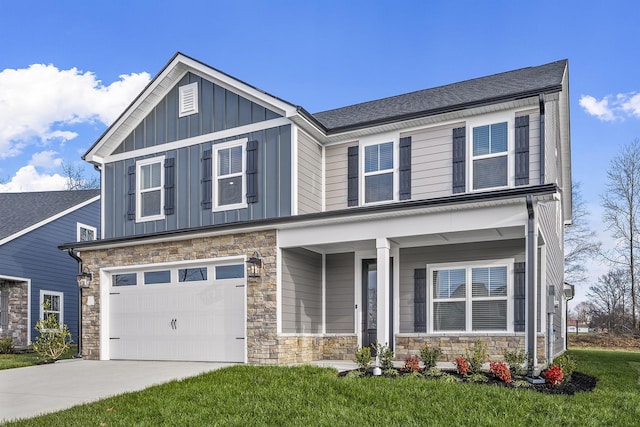 craftsman-style house featuring a garage, a front yard, and covered porch