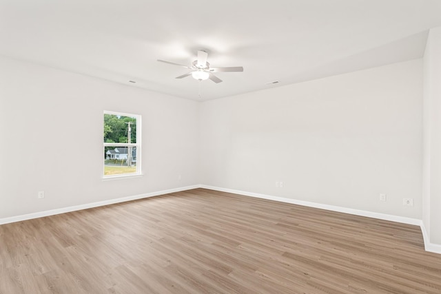 unfurnished room featuring ceiling fan and light hardwood / wood-style flooring