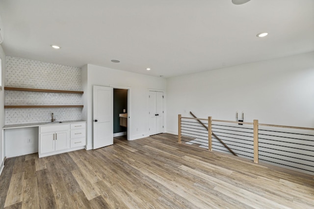 interior space with light wood-type flooring and sink