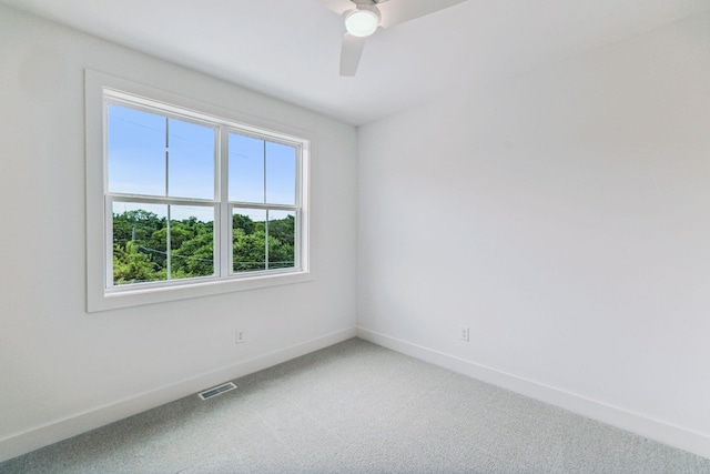 carpeted empty room with ceiling fan