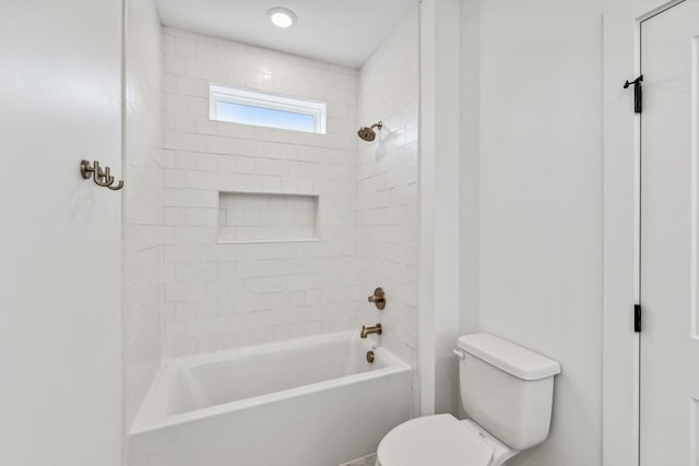 bathroom with toilet and bathtub / shower combination