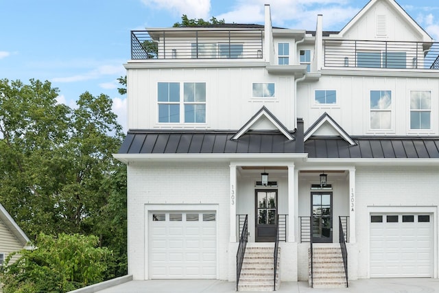 view of front of property with a porch and a garage