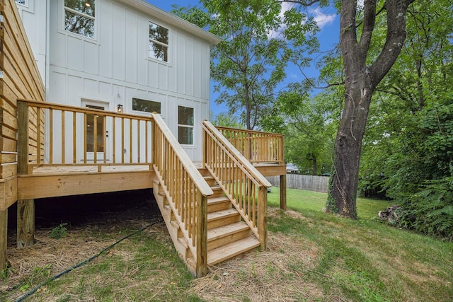 wooden deck featuring a yard