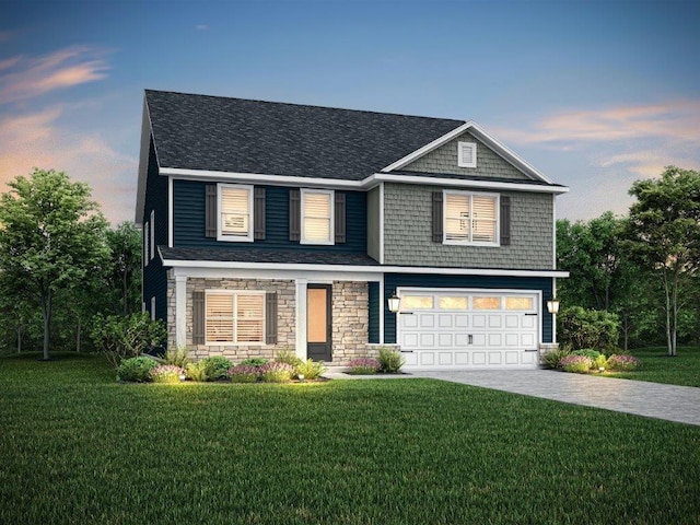 view of front of property with a garage and a lawn