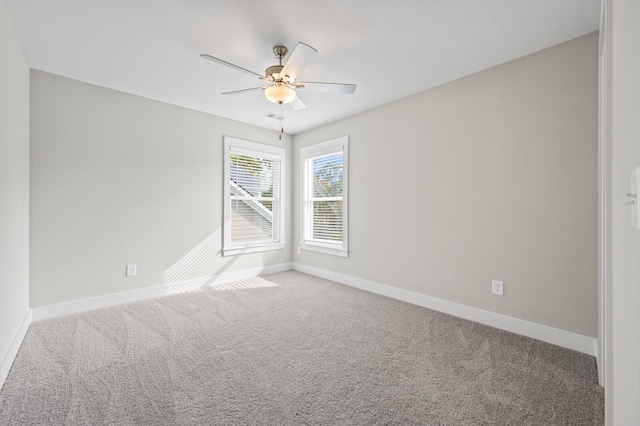 carpeted empty room with ceiling fan