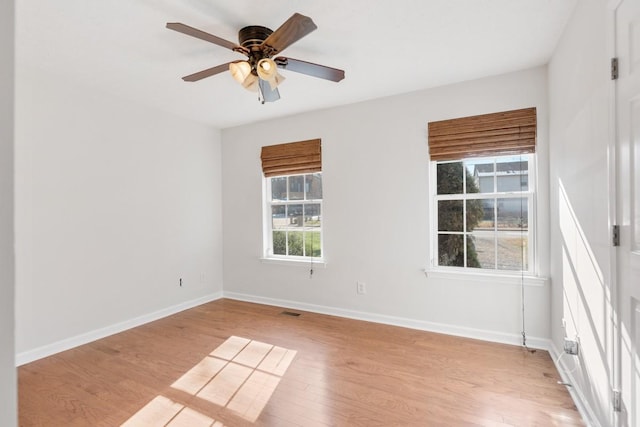 spare room featuring ceiling fan and light wood-type flooring