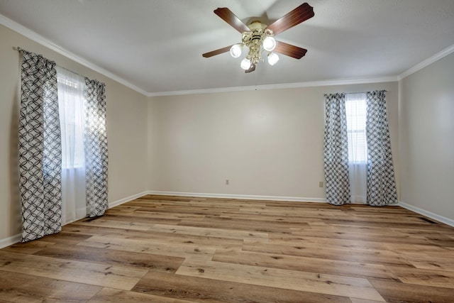 unfurnished room featuring ceiling fan, crown molding, and light hardwood / wood-style floors