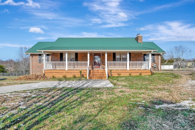 view of front of house featuring a front lawn and a porch