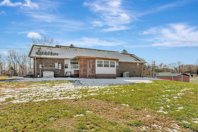 exterior space with cooling unit and a yard