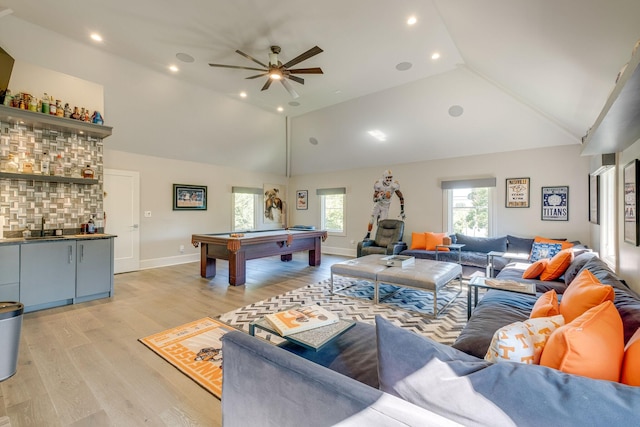 recreation room with ceiling fan, billiards, sink, light hardwood / wood-style flooring, and high vaulted ceiling