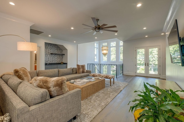 living room with french doors, ceiling fan, ornamental molding, and hardwood / wood-style floors