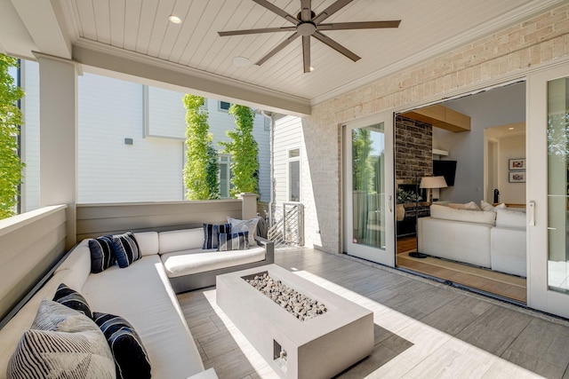 sunroom / solarium with wooden ceiling and ceiling fan