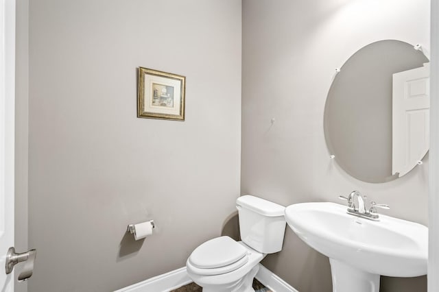 bathroom featuring sink and toilet