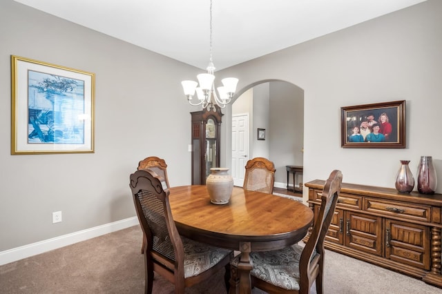 dining area featuring an inviting chandelier and carpet floors