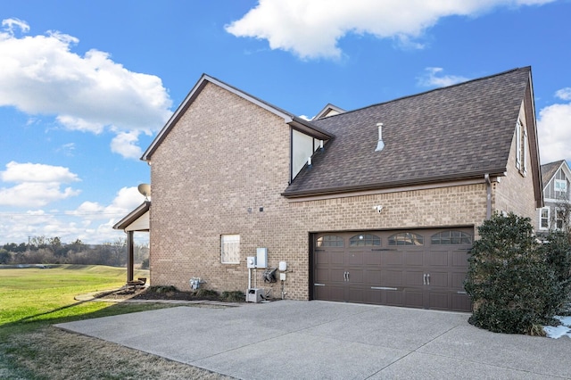 view of home's exterior featuring a garage and a lawn