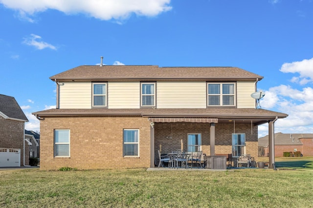 back of house featuring a yard and a patio