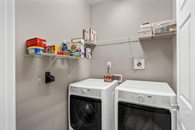 laundry area with washing machine and clothes dryer