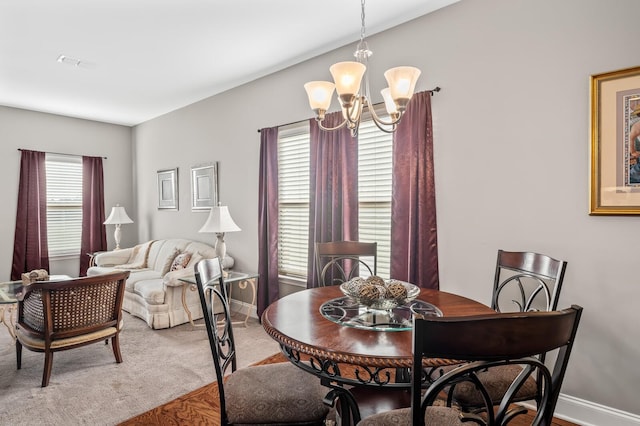 dining space with a chandelier