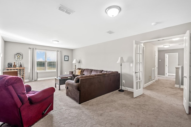 carpeted living room with french doors