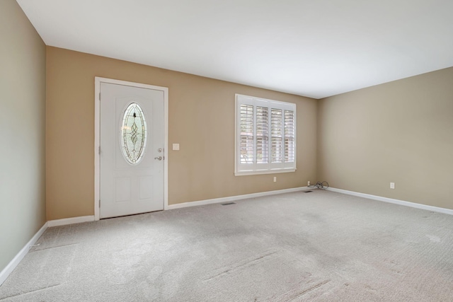 view of carpeted entrance foyer