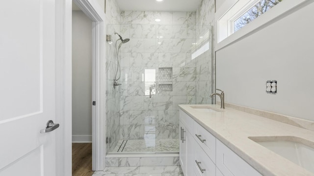 bathroom with an enclosed shower and vanity