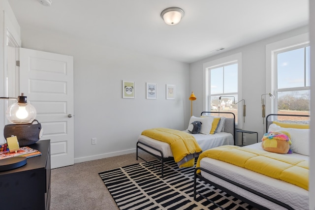 bedroom with light carpet, visible vents, and baseboards