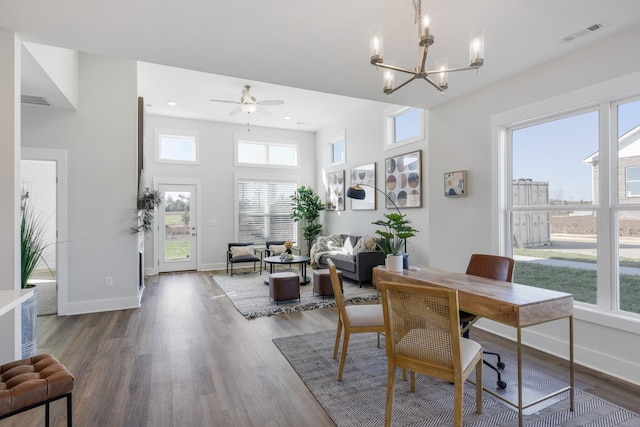 office area with a wealth of natural light, visible vents, and dark wood finished floors