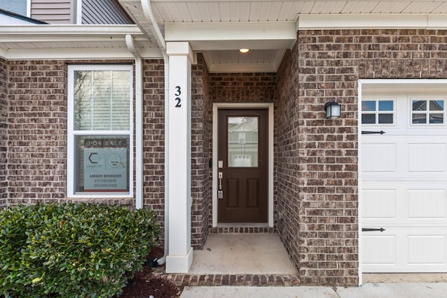 property entrance with a garage