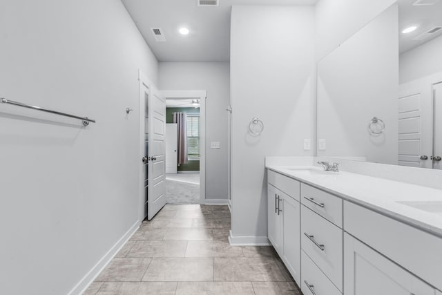 bathroom featuring ceiling fan and vanity