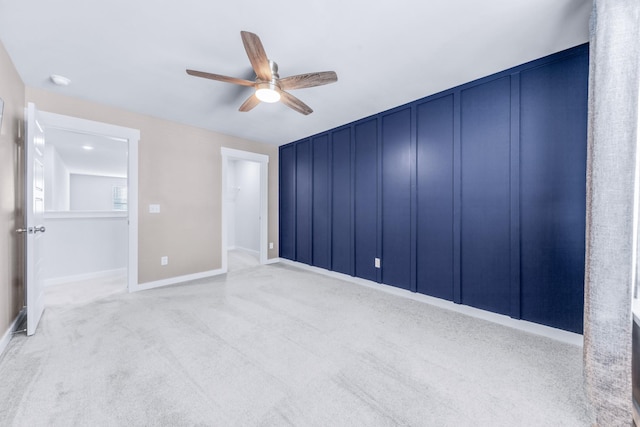 unfurnished bedroom with ceiling fan and light carpet