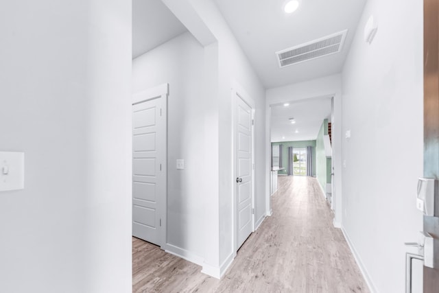 corridor featuring light hardwood / wood-style flooring