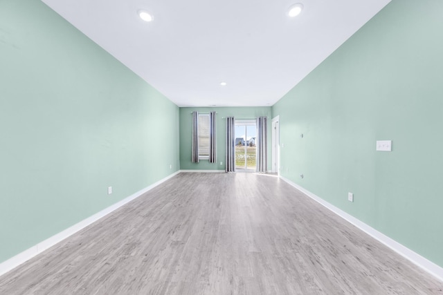 spare room featuring light hardwood / wood-style flooring