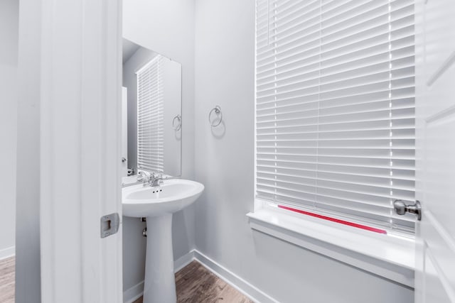 bathroom featuring sink and hardwood / wood-style floors