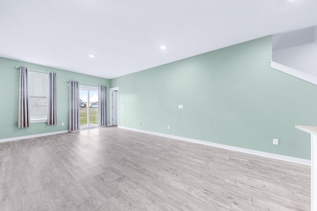 spare room featuring light wood-type flooring