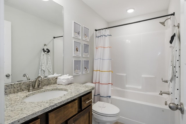 full bathroom featuring toilet, vanity, and shower / tub combo with curtain