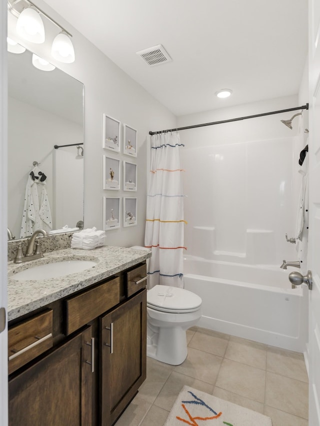 full bathroom with shower / bath combo with shower curtain, toilet, vanity, and tile patterned flooring