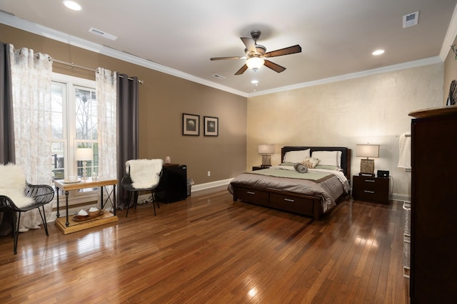 bedroom featuring ceiling fan, crown molding, and dark hardwood / wood-style floors