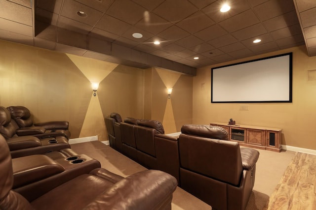 home theater with carpet floors and a paneled ceiling