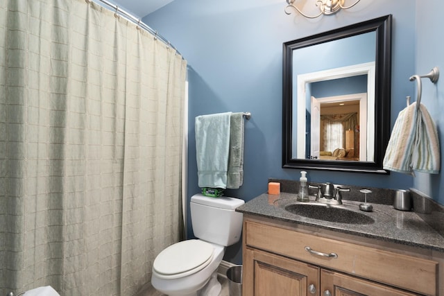 bathroom featuring toilet and vanity