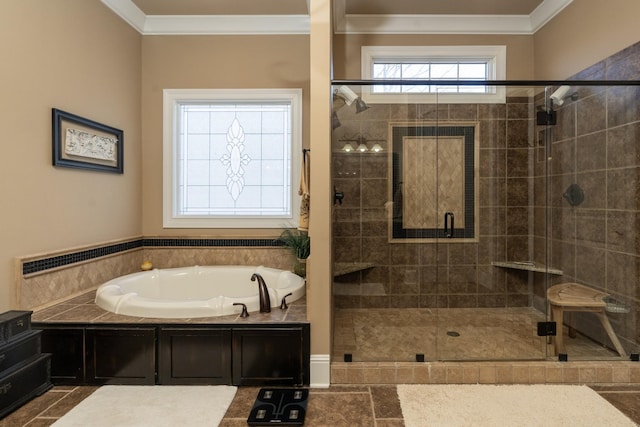 bathroom featuring ornamental molding and shower with separate bathtub