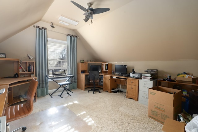 carpeted home office with vaulted ceiling and ceiling fan