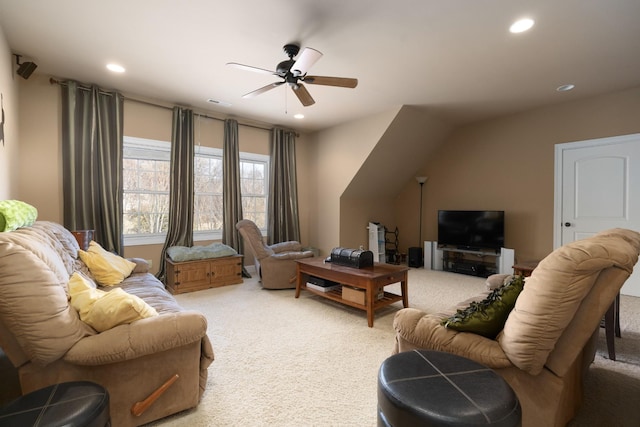 carpeted living room featuring ceiling fan