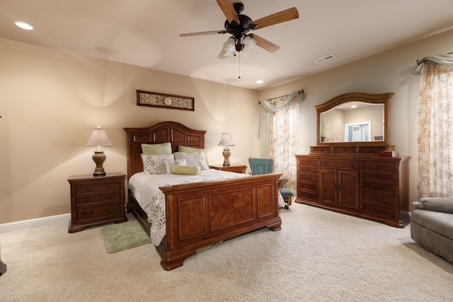 bedroom with ceiling fan and light colored carpet