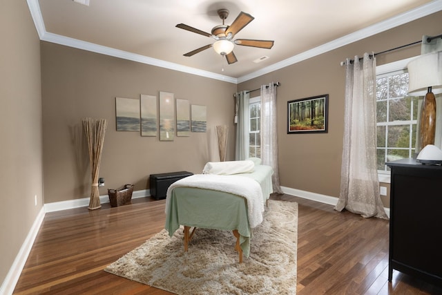 bedroom featuring ceiling fan, dark hardwood / wood-style flooring, and ornamental molding