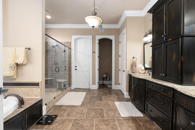 bathroom with vanity, crown molding, and independent shower and bath