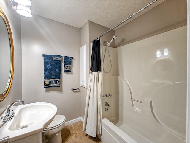 full bathroom with toilet, tile patterned floors, shower / tub combo, sink, and a textured ceiling