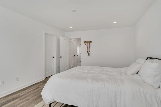 bedroom featuring wood-type flooring