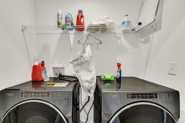 washroom featuring washing machine and clothes dryer