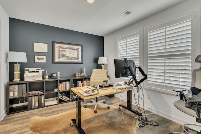 office area with hardwood / wood-style flooring and plenty of natural light