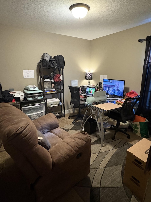 home office with a textured ceiling and carpet